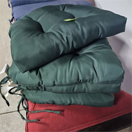 Four  dark green, tufted chair cushions