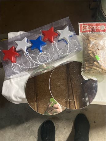 Set of red, white, and blue star-shaped string lights, a bag of wooden clothespi