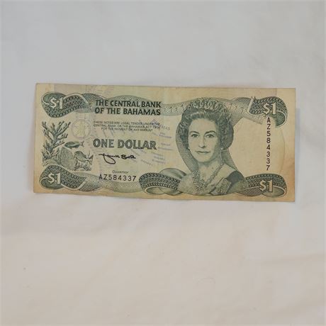 One Bahamian dollar banknote, featuring Queen Elizabeth II.