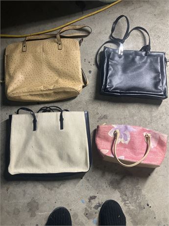 Collection of various bags, including a beige faux-ostrich tote, a black leather
