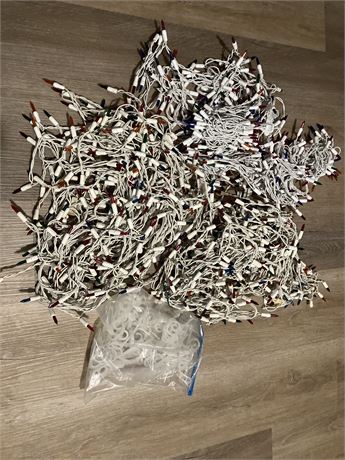 Large lot of white stringed multicolor lights with clear hanging hooks for outsi