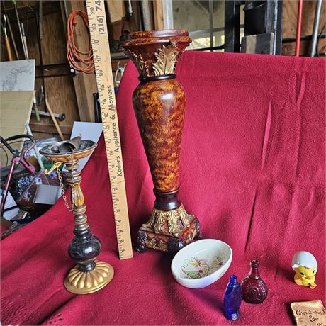 Various decorative items, including a figurine, small glass bottles, a ceramic b