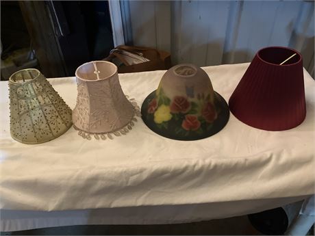 4 mini lampshades (one gold/patterned, one pink/beaded, one glass/floral, one bu