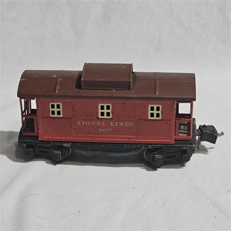 Vintage Lionel Lines 2657 caboose. It is an O-gauge model train car, specifical