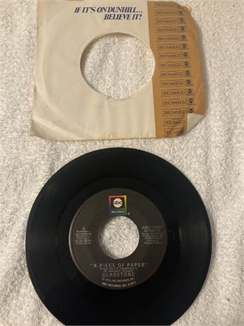 45 RPM vinyl single by the band Gladstone.  Title: "A Piece of Paper" / "Livin'