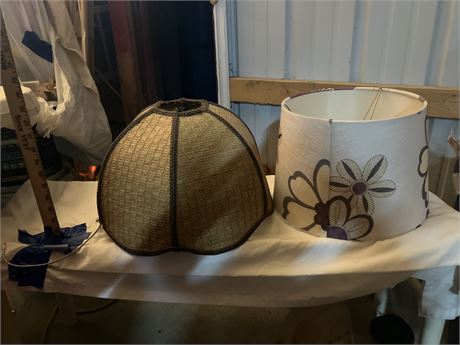 Two lampshades (one offwhite/floral, one brown/straw material)