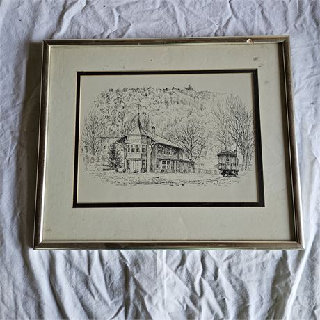 Artwork is a framed print that features a detailed pen-and-ink style drawing
