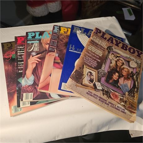Assortment of 7 Playboy magazines
