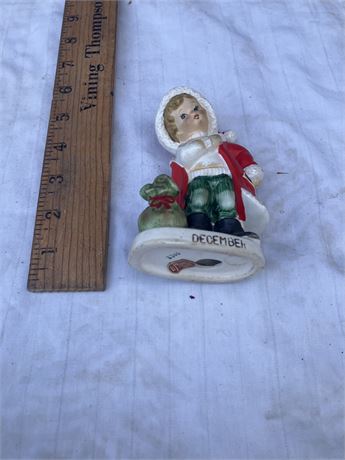 Lefton figurine, specifically a "December" birthday or Christmas figurine.