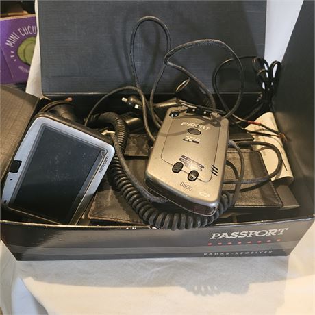 Escort Passport 8500 X50 Radar and Laser Detector along with a TomTom GPS device