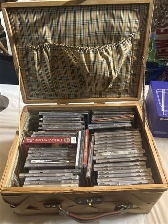 Cool picnic basket filled with miscellaneous cds and dvds (56 total)