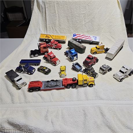 Collection of diecast toy trucks and trailers,