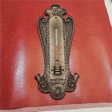 Antique wall-mounted thermometer