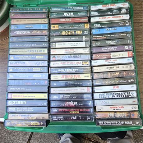Approximately 60 audio cassette tapes, primarily featuring rock music albums