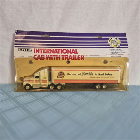 NIP Ertl 1987 Intl. Cab w/Trailer Die-Cast