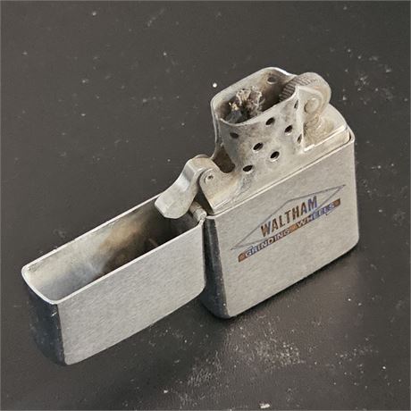 1961 Vintage Zippo lighter advertising "Waltham Grinding Wheels".