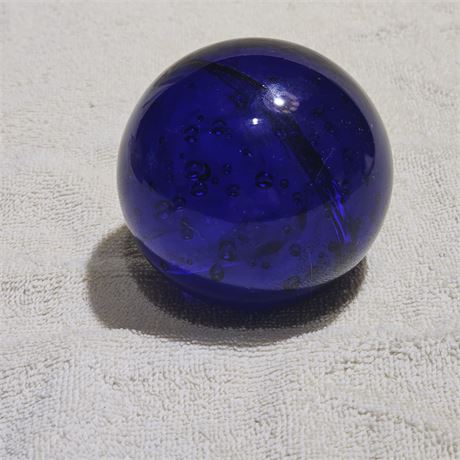 Cobalt blue art glass paperweight or decorative glass float, often featuring co