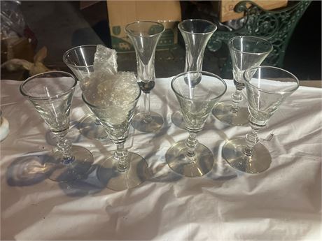 7 vintage crystal stemmed glasses, likely cordial or sherry glasses