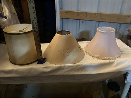 3 lampshades (one beige/brown, one pink/with beading, one beige/with cut-outs)