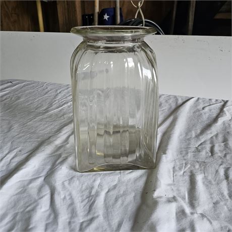vintage square glass jar, possibly a pickle jar or a canister. It has a ribbed